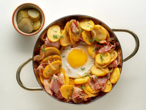 Skillet with Fried Eggs, Potatoes and Bacon